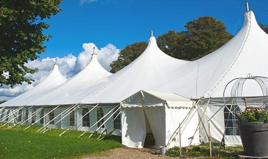 a line of sleek and modern portable toilets ready for use at an upscale corporate event in Belmont